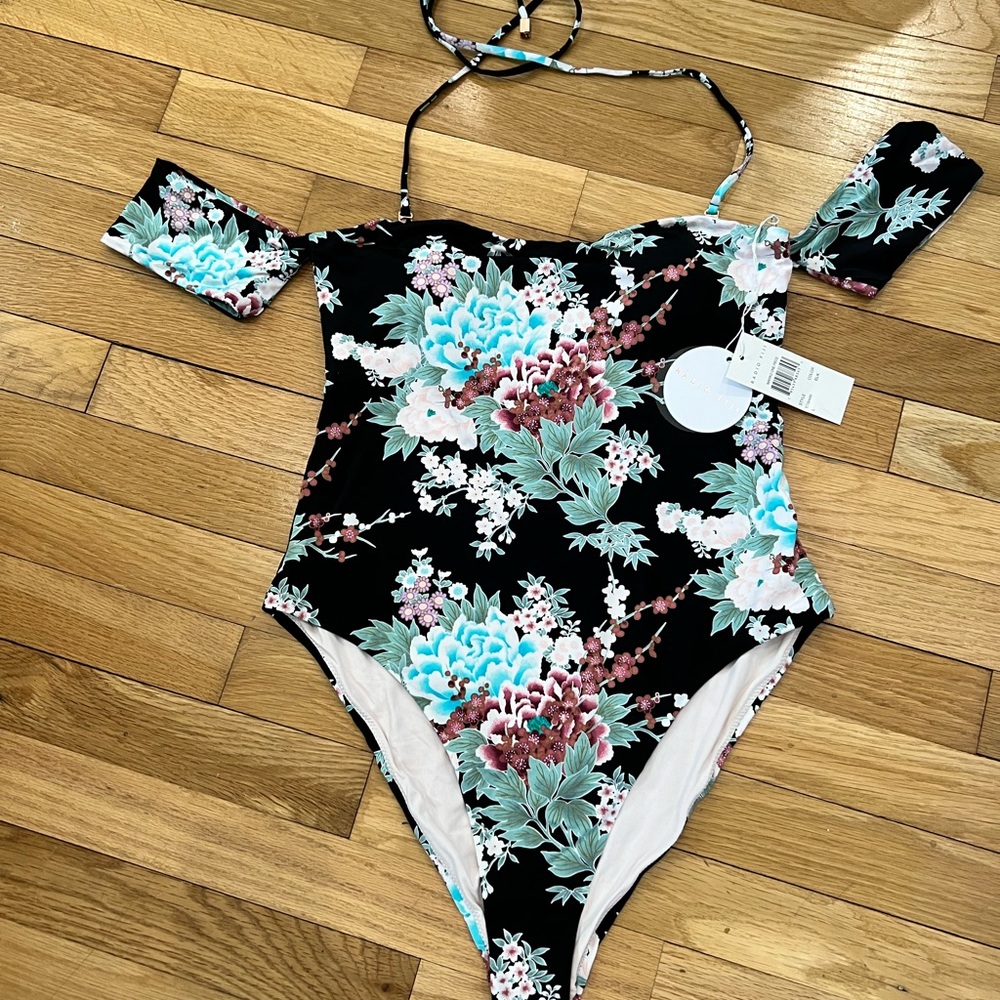 Beautiful off the should one piece. Brand new never worn with tags.